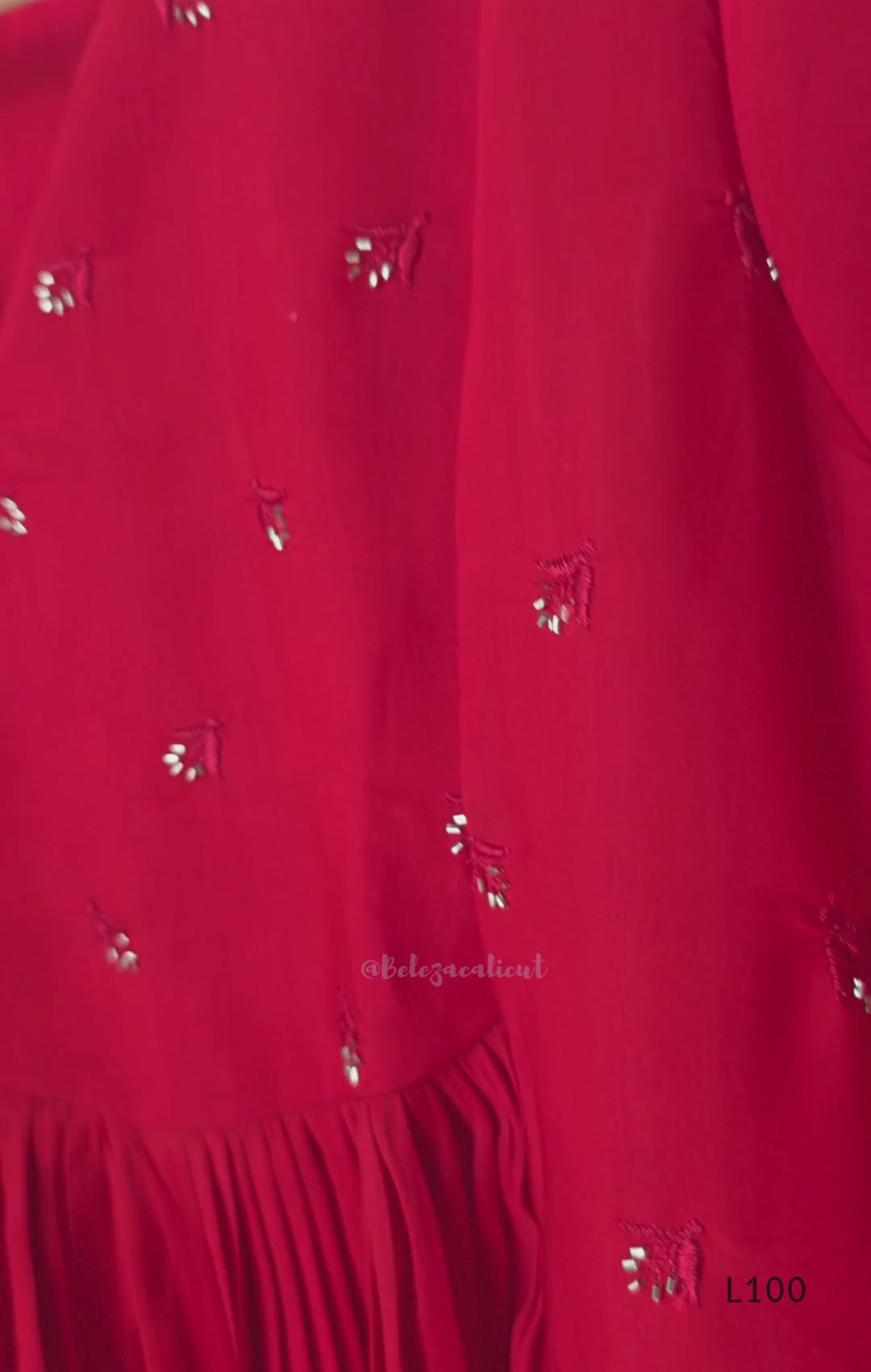 Red mul chanderi A-line kurti with V-neck, gathered front panel, 3/4 sleeves and small scattered embroidery.